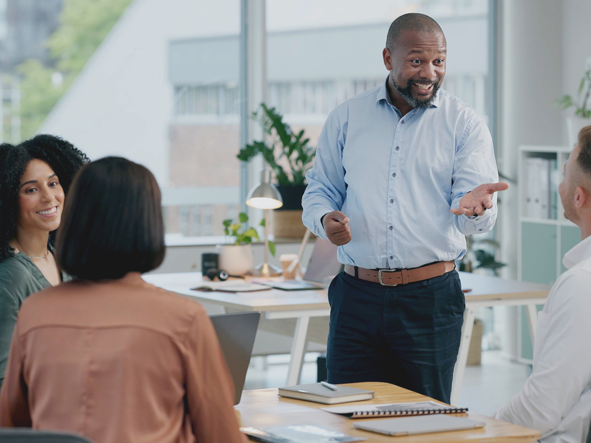 he shows effective people management in a meeting with employees under his supervision