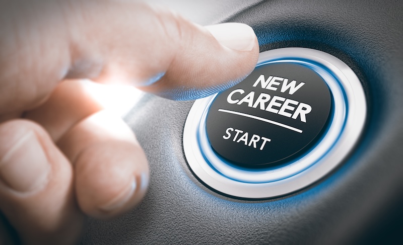 finger pressing a new career start button. Concept of occupational or professional retraining or job opportunities. Composite between a hand photography and a 3D background