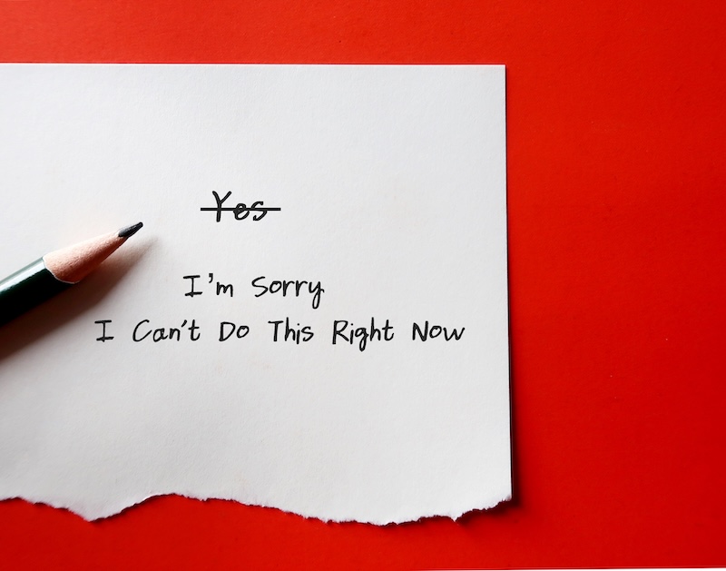 A handwritten note on white paper with the word 